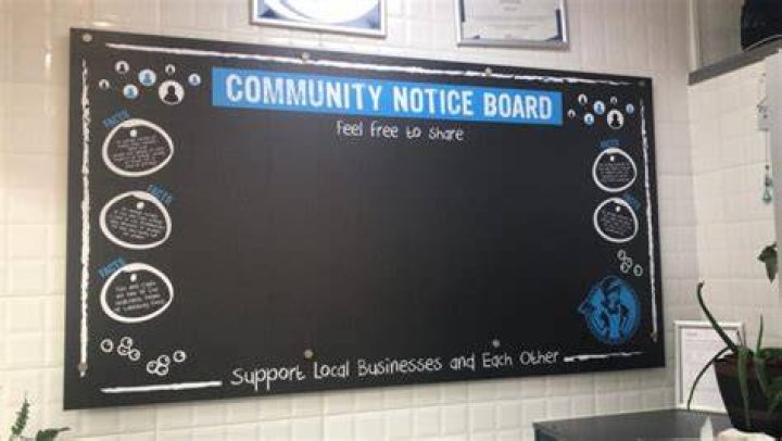 Catch the bird on top of the notice board?