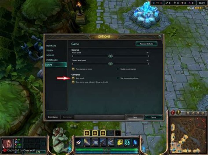 How do I prevent my champion from attacking minions that are in range?