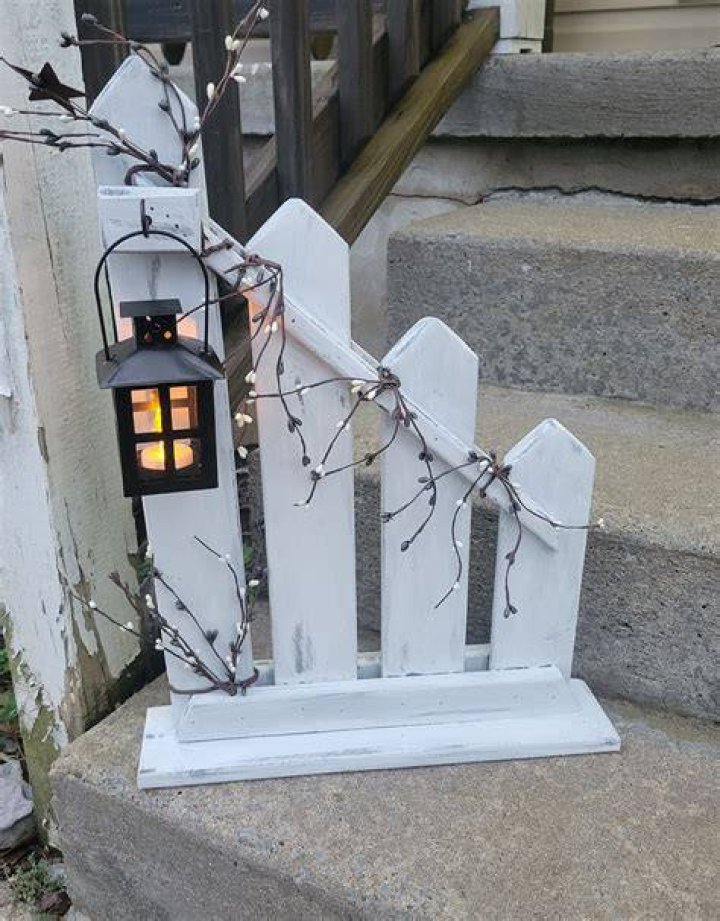 Lantern hanging below fence